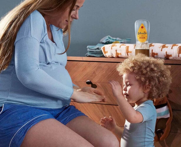 woman applying baby oil
